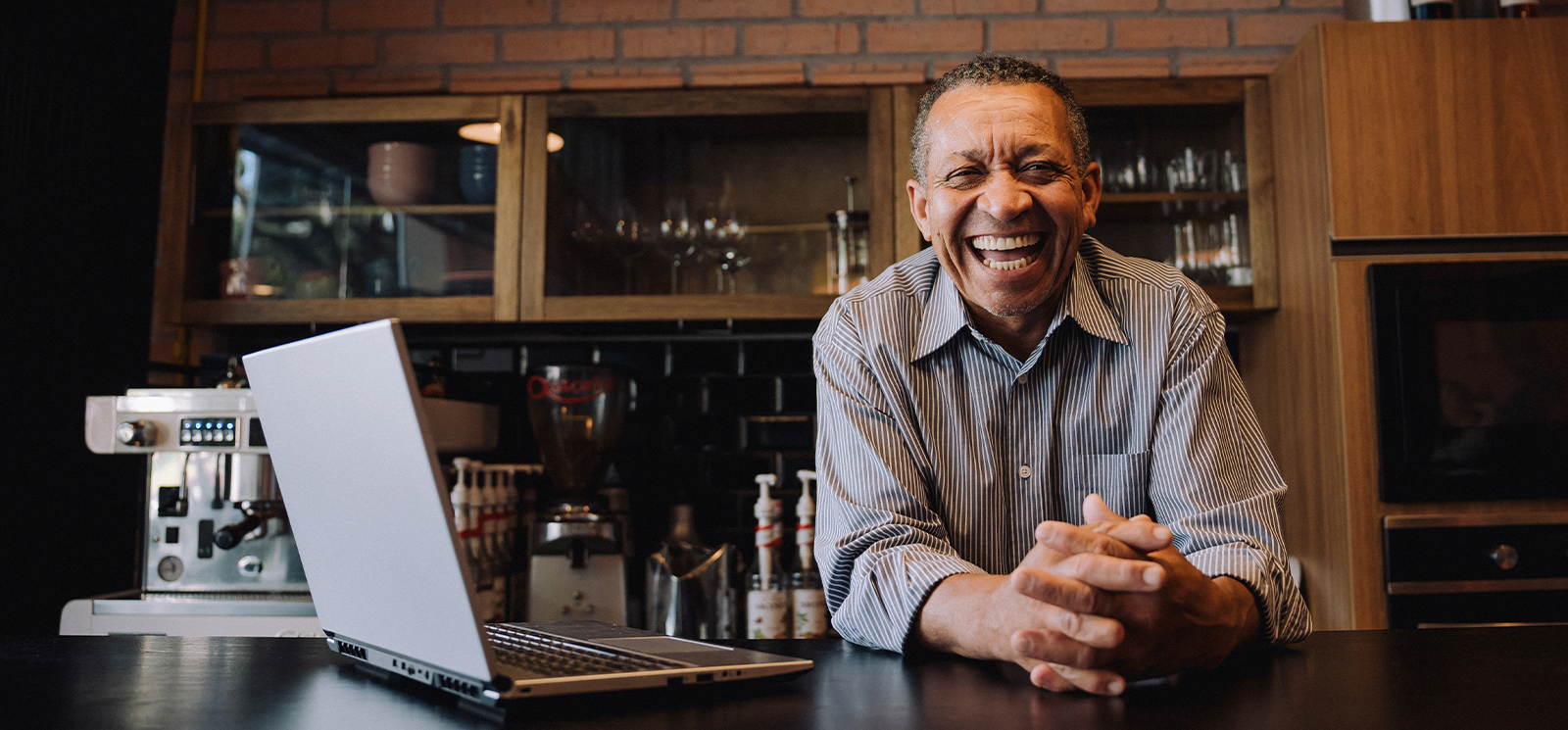 Laughing male business owner