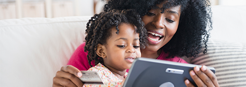 Mom and daughter completing online payment